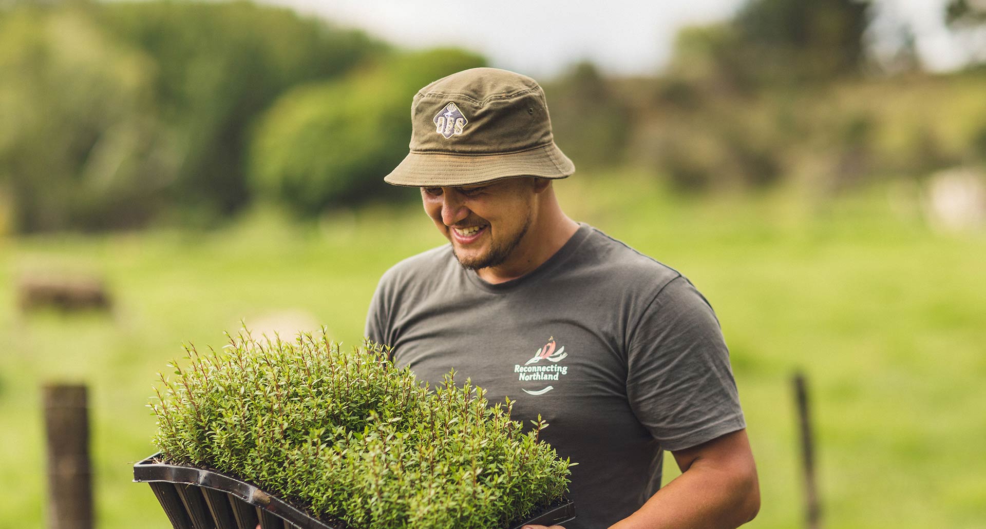 man holding a bush