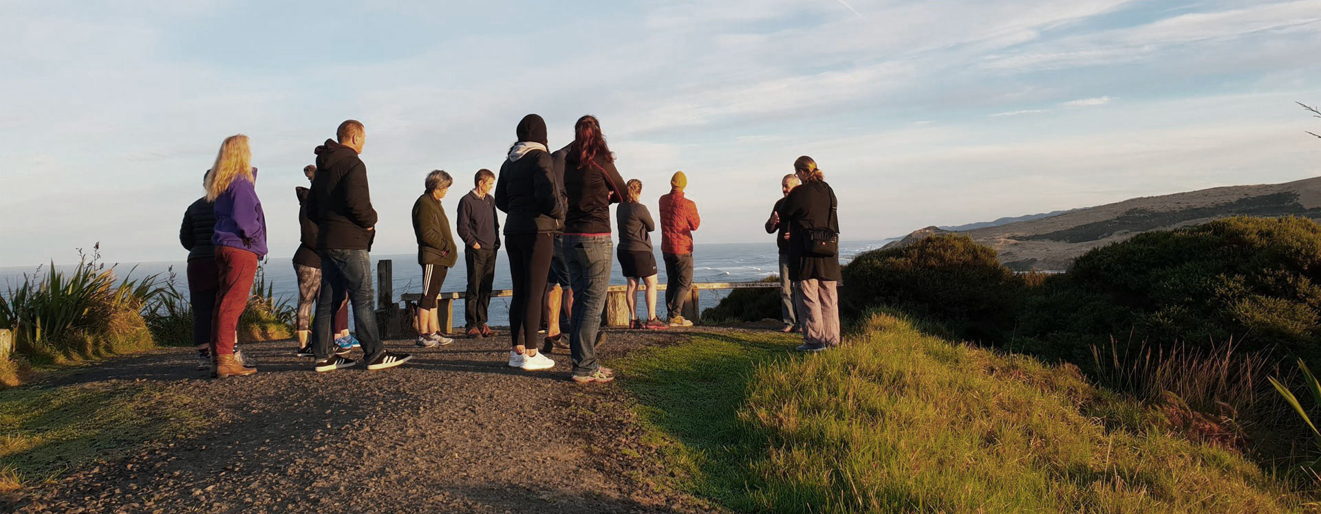 People look out over the ocen